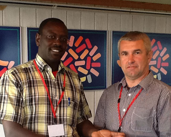 Richard-Aiyabei,-Kenya---receiving-World-Ploughing-Badge-as-a-new-Board-Member-2015